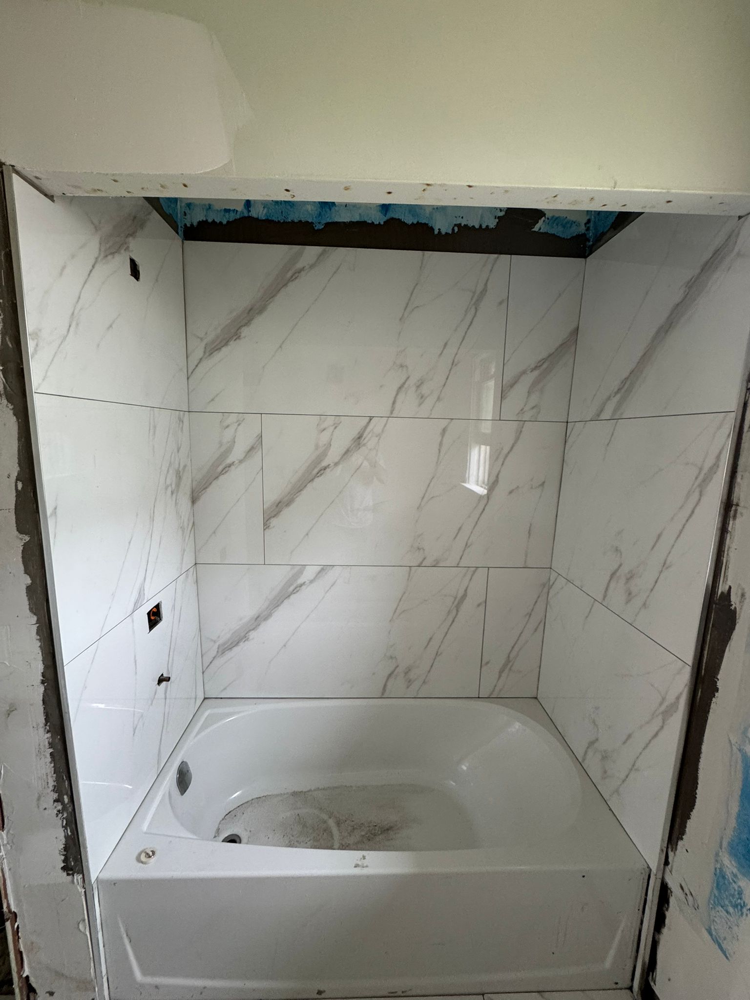 Bathtub surround marble tile detail