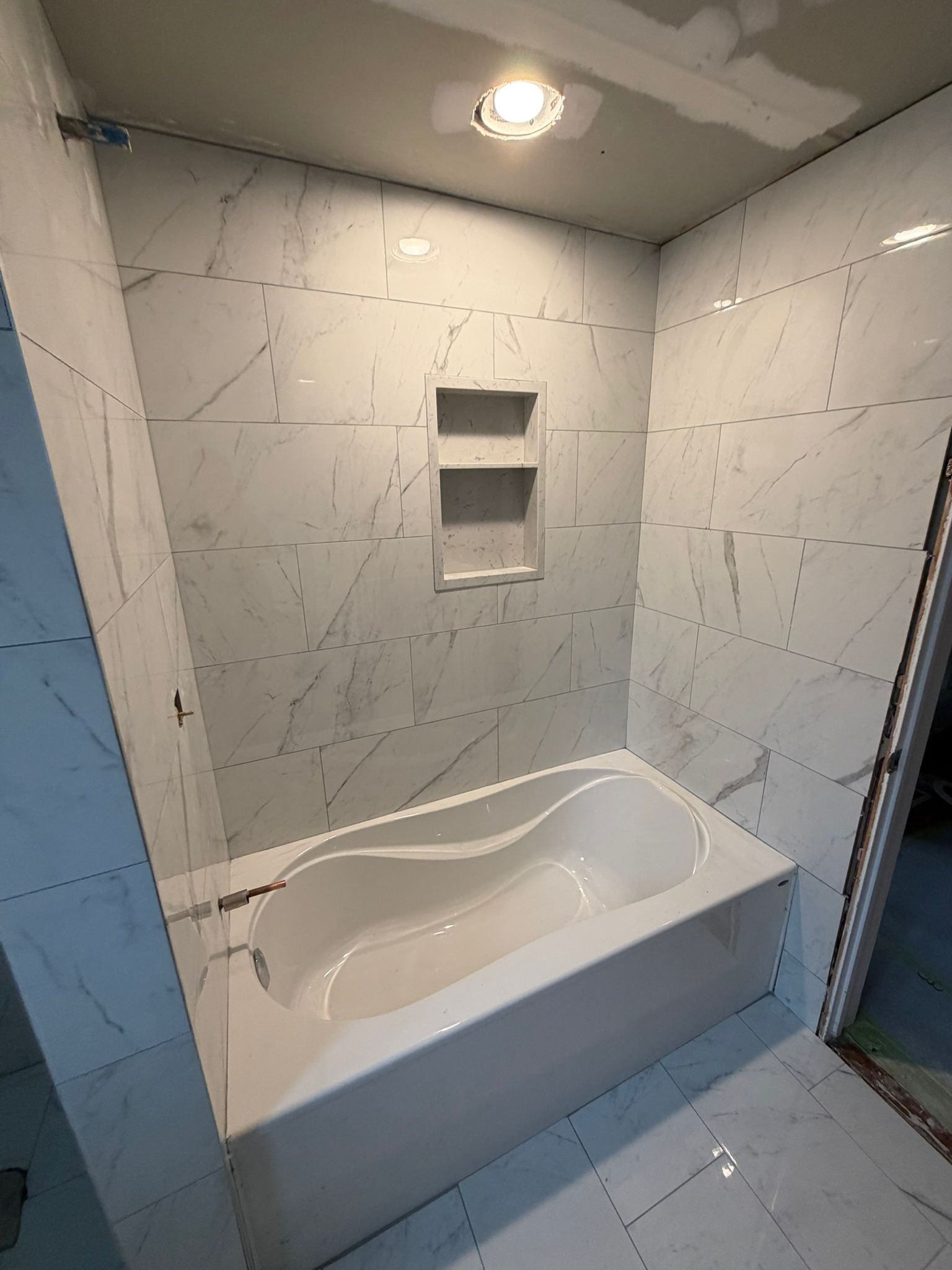 Finished condo bathroom tile work